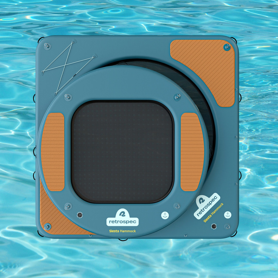 A square inflatable hammock behind a circular inflatable hammock with a clear water background.