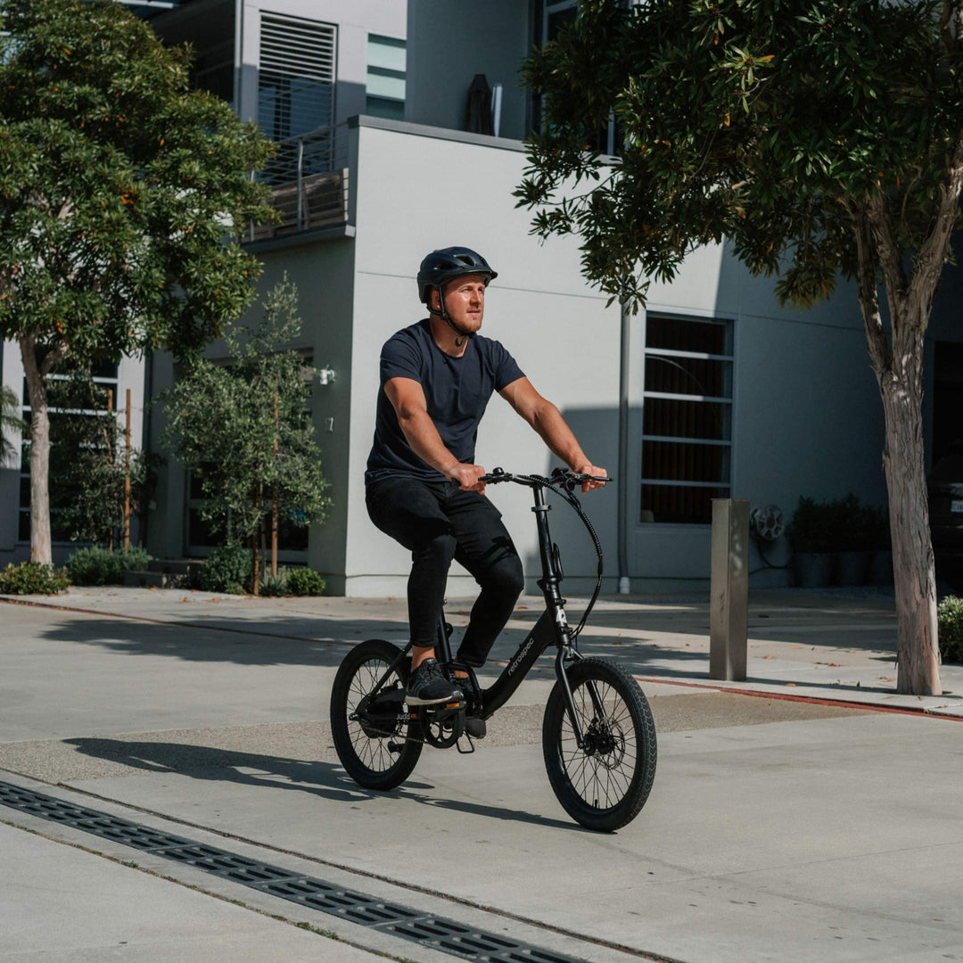 commuter on a city and ebike with a helmet