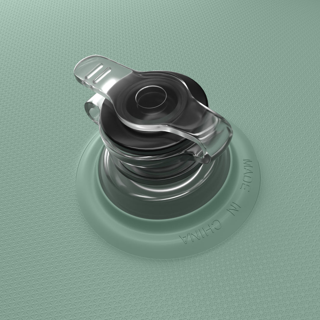 A close-up view of a seafoam Siesta River Tube's transparent and black circular plastic valve.