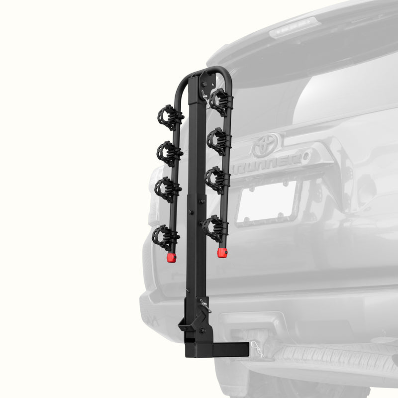 retrospec Lenox Hitch Mount Car Bike Rack (4-Bikes)
installed on the rear of a Toyota 4Runner, shown empty in the folded upright position with cradle arms raised and red safety caps in place.
