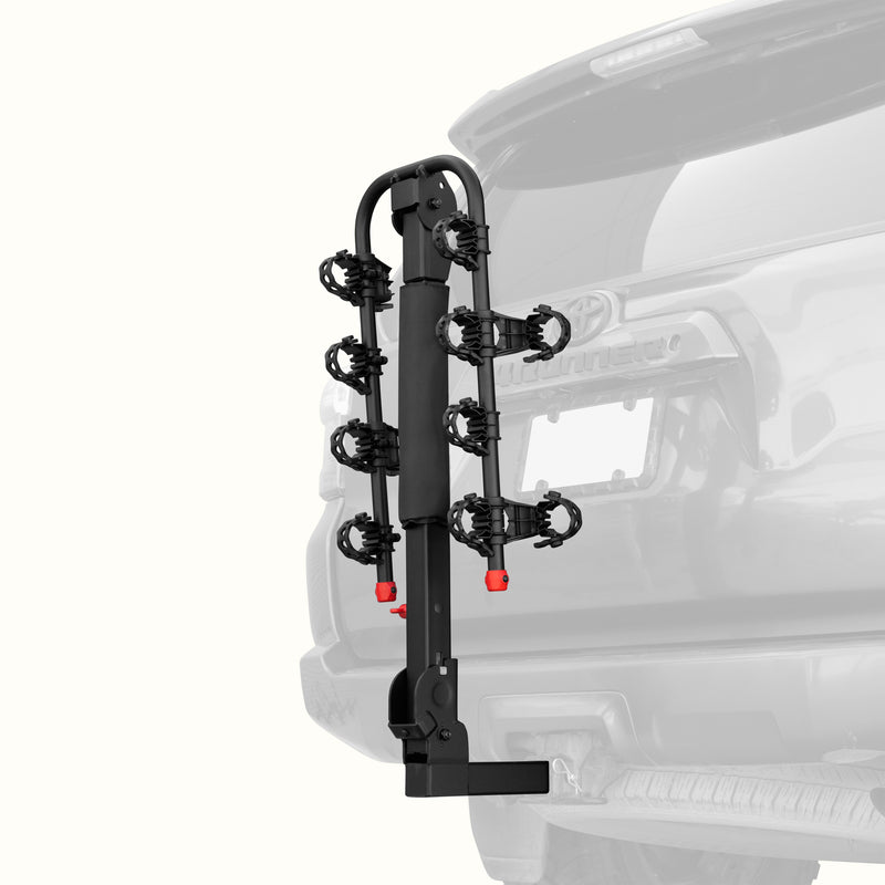 retrospec Lenox Plus Hitch Mount Car Bike Rack (4-Bikes)
installed on the rear of a Toyota 4Runner, shown empty in the folded upright position with cradle arms raised and red safety caps in place.
