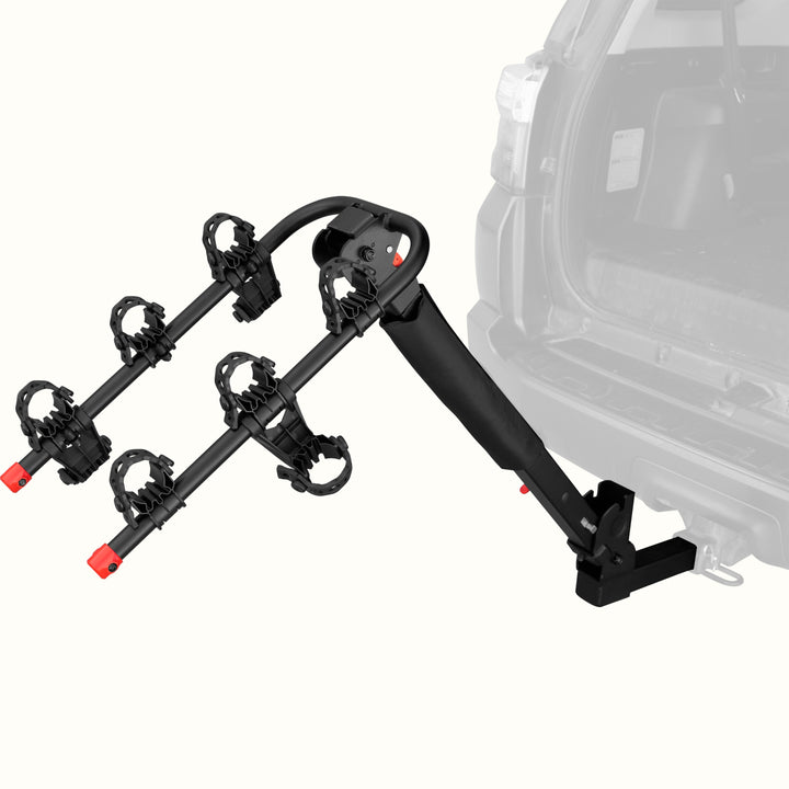 retrospec Lenox Plus Hitch Mount Car Bike Rack (3 Bikes) installed on the rear hitch of a Toyota 4Runner, shown empty from a rear angle with cradle arms raised and red safety caps in place.