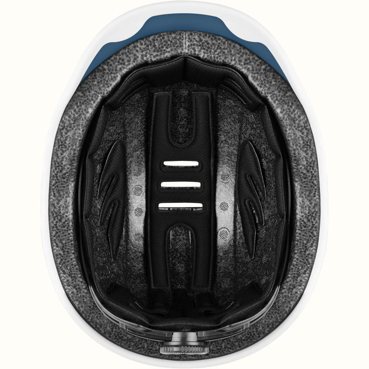 Interior of a retrospec remi youth bike helmet showing cushioned padding and adjustable strap channels.