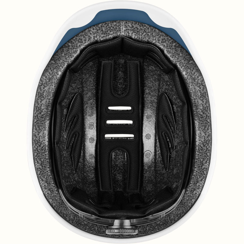 Interior of a retrospec remi youth bike helmet showing cushioned padding and adjustable strap channels.