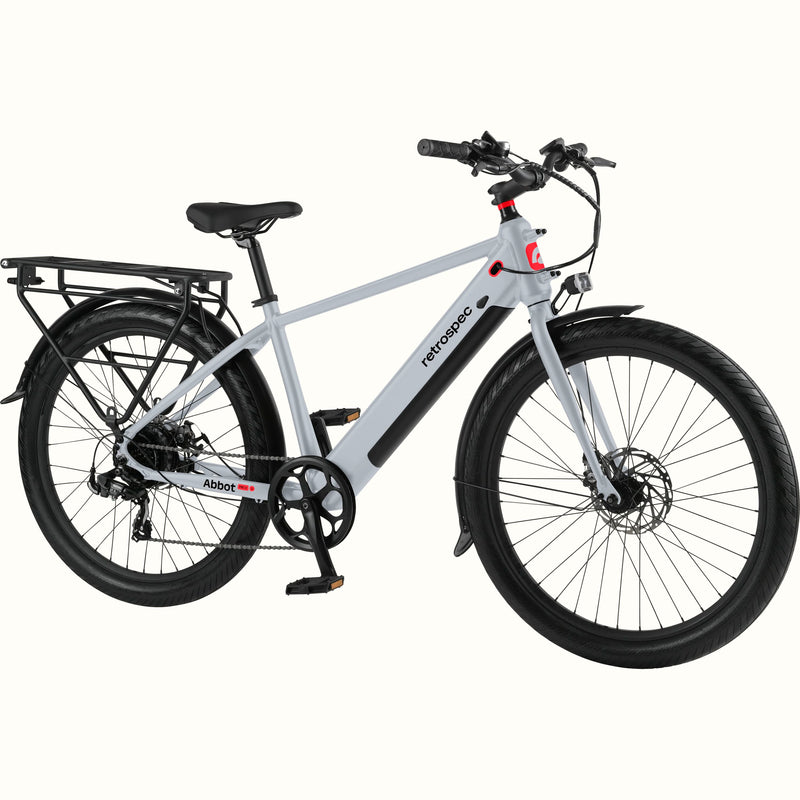 Gray Abbot Rev 2 Commuter Electric Bike with red accents and rear rack on a white background.