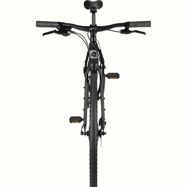 front view of retrospec Amok gravel bike cockpit with flat bar, brake levers, and knobby front tire in matte black.
