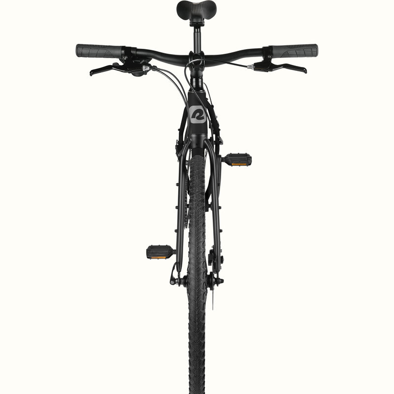 front view of retrospec Amok gravel bike cockpit with flat bar, brake levers, and knobby front tire in matte black.