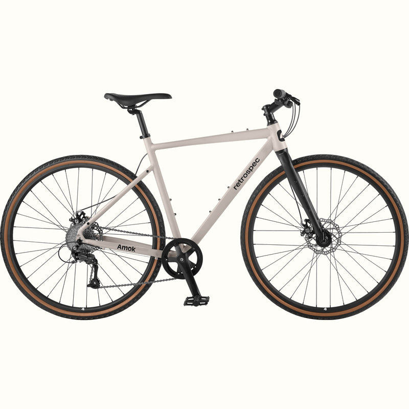 Gray bicycle with black components on a white background.