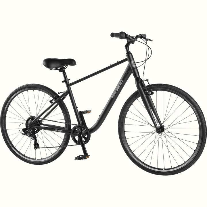 retrospec Barron hybrid bike for men in matte black, with step-over frame, Shimano drivetrain, and upright cruiser bars.