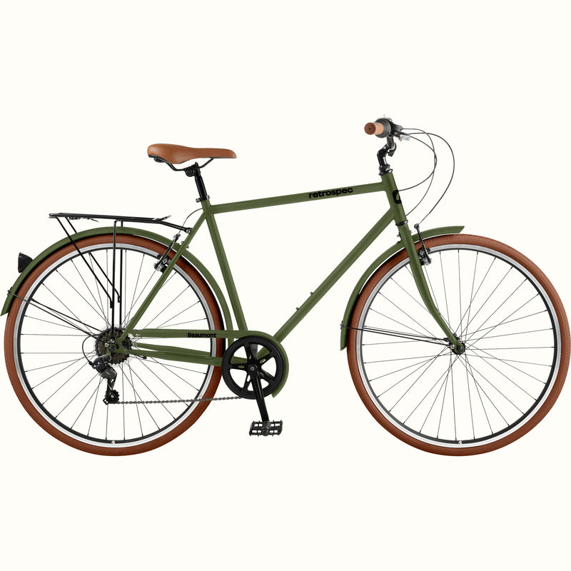retrospec Beaumont 7 speed city bike in matte olive drab, featuring a step-over frame and chrome cargo rack.