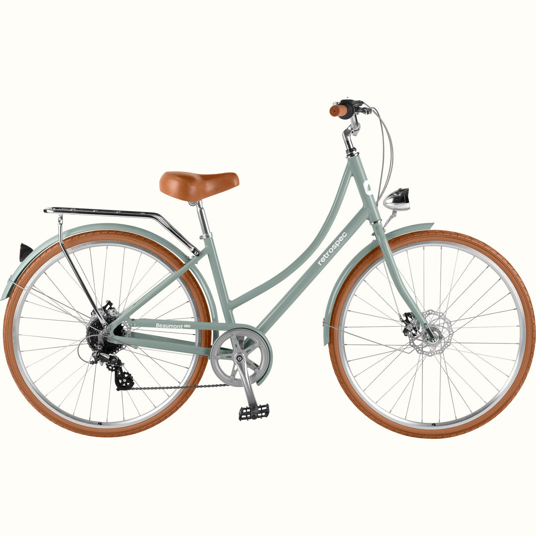 retrospec Beaumont Plus step through bike front view with tan saddle, grips, and round headlight in sage haze.