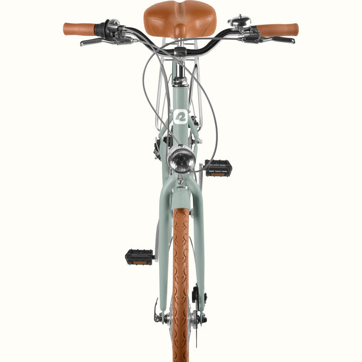 retrospec Beaumont Plus step through city bike in sage haze with front headlight, rear rack, and disc brakes.
