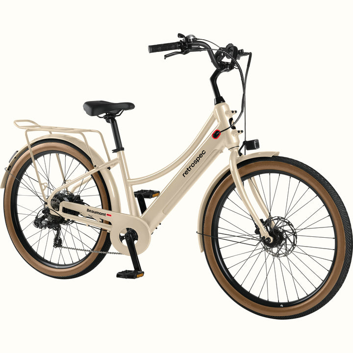Beige Beaumont Rev+ Electric bicycle with brown tires on a white background.