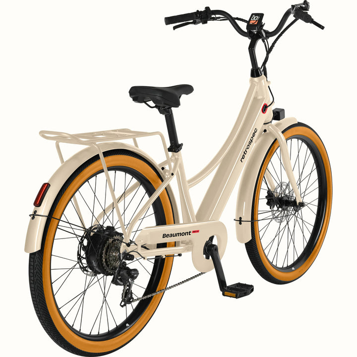 Beige Beaumont Rev+ Electric bicycle with brown tires  and a rear rack on a white background.