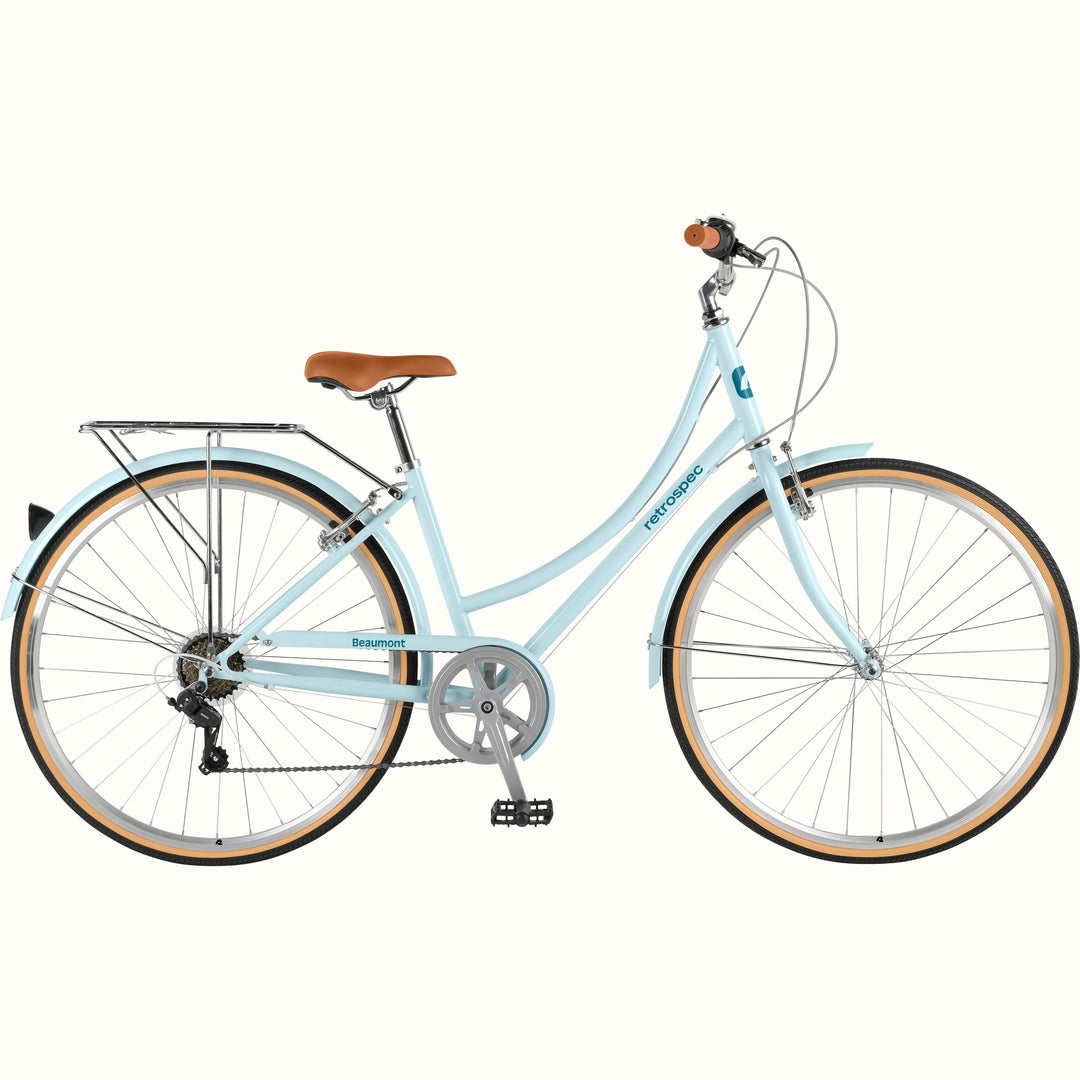 retrospec Beaumont Step Through Commuter Bike in larimar blue with rear rack, tan-wall tires, and brown leather saddle.