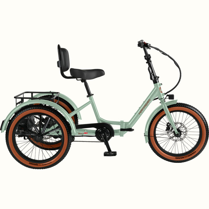 The Matcha Boca Rev 2 Electric Tricycle with a rear basket and brown accents on the tires shown on a white background.