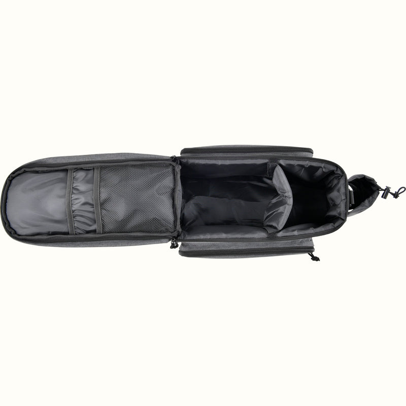 A top interior view of a gray heather bicycle trunk bag showing the large main compartment, mesh storage, two zippered exterior side pockets, and a side bottle holder, shown on a plain white background.