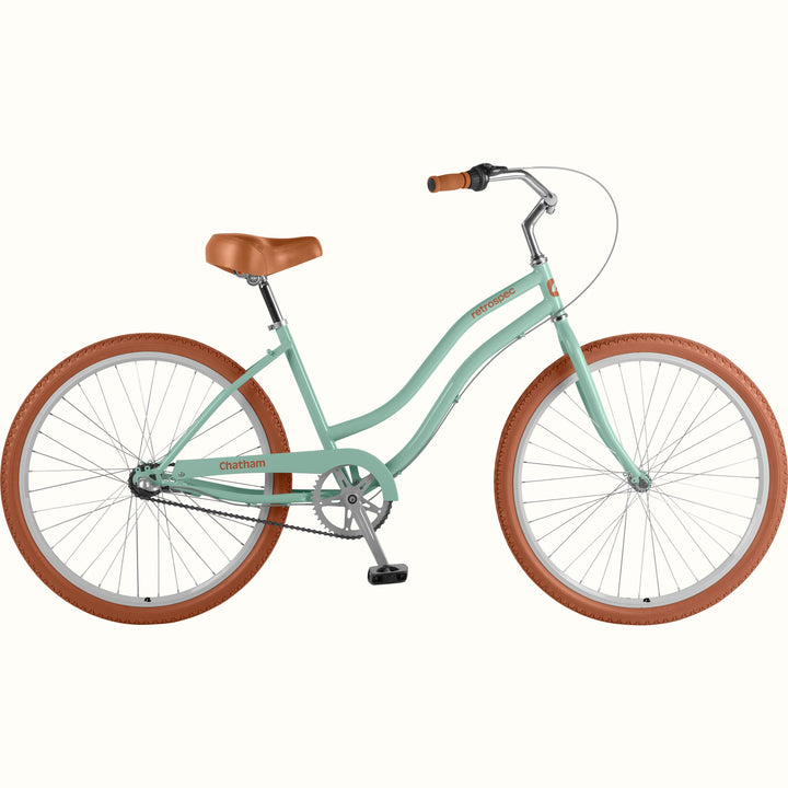 A matcha green step-through bicycle with brown tires, a brown leather saddle, and silver metal components, shown against a plain off-white background.