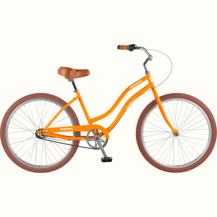 retrospec Chatham orange beach cruiser bike with tan leather saddle and brown tires, right side view.