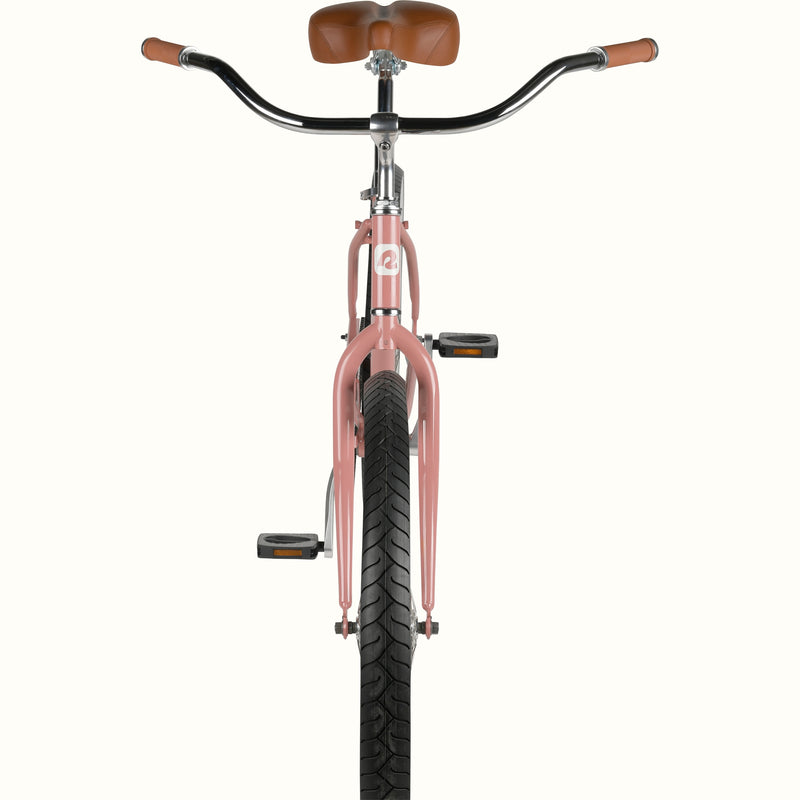 Front view of a pink cruiser bicycle with brown grips and saddle.