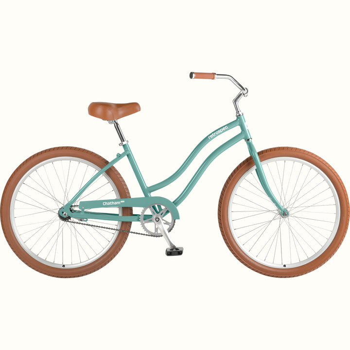 retrospec Chatham Plus women's cruiser bike in aquastone with tan tires, brown leather saddle, and step-through steel frame, side view.