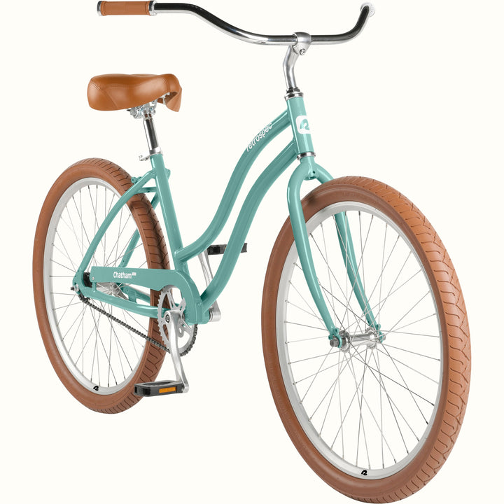 retrospec Chatham Plus beach cruiser bicycle in aquastone, three-quarter view showing swept-back handlebars, tan tires, and chrome accents.