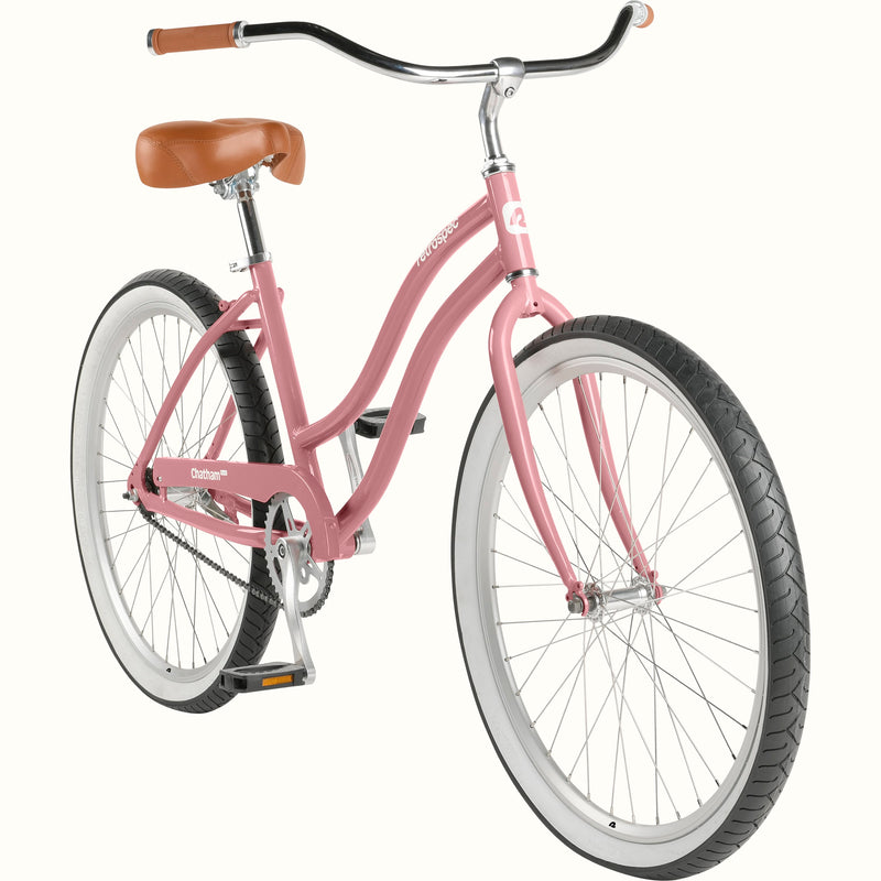 retrospec Chatham Plus women's cruiser bike in dusty rose, three-quarter view highlighting swept-back handlebars, white rims, and low step-through frame.