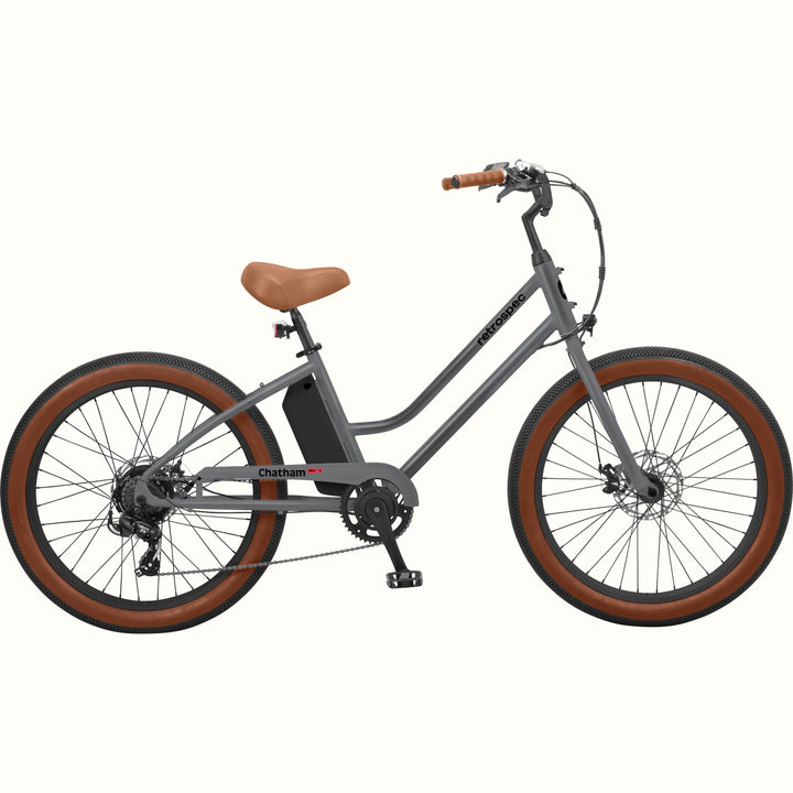 A matte graphite Chatham Rev 3 Beach Cruiser Electric Bike - Step Through with a brown seat, wide tires, and a sleek design, ideal for casual riding.