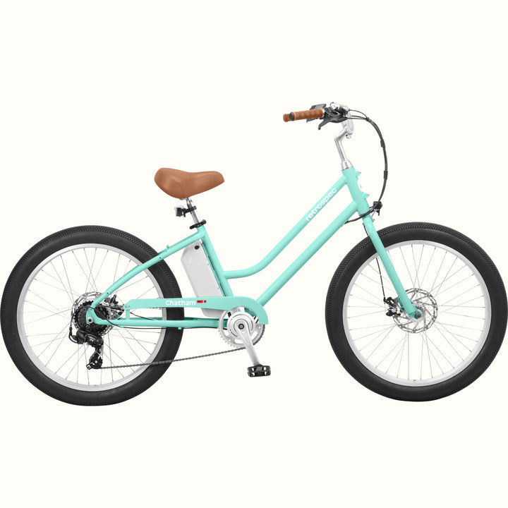 A seafoam Chatham Rev 3 Beach Cruiser Electric Bike - Step Through with a brown seat, wide tires, and a sleek design, ideal for casual riding.
