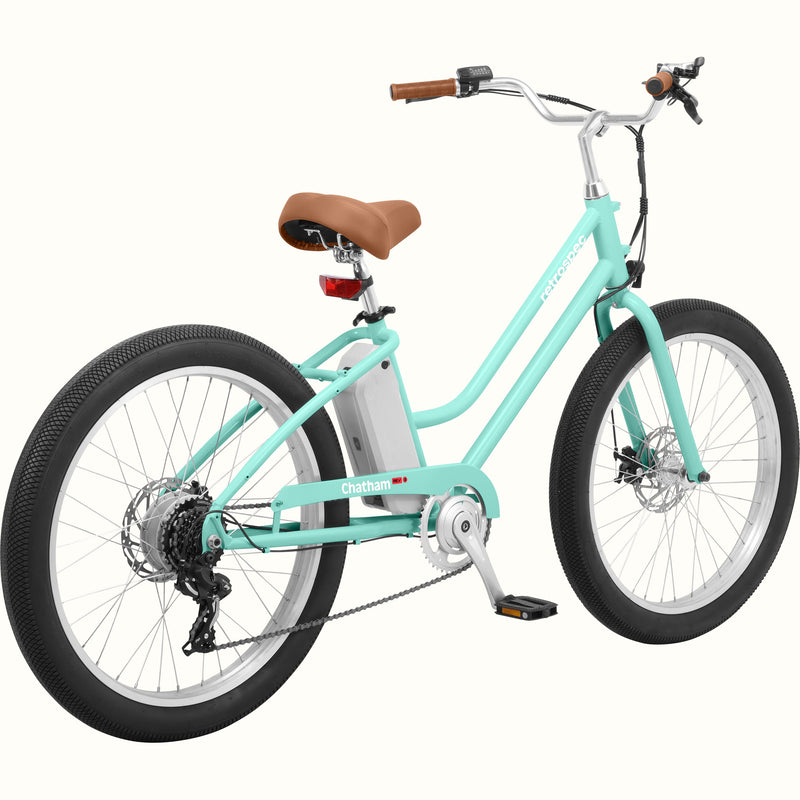 A seafoam Chatham Rev 3 Beach Cruiser Electric Bike - Step Through with a brown seat, wide tires, and a sleek design, ideal for casual riding.