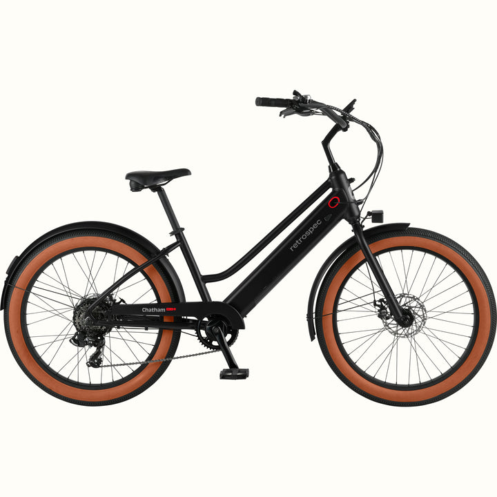 Black Chatham Rev+ 2 Beach Cruiser Electric Bike - Step Through with brown wheels on a white background.