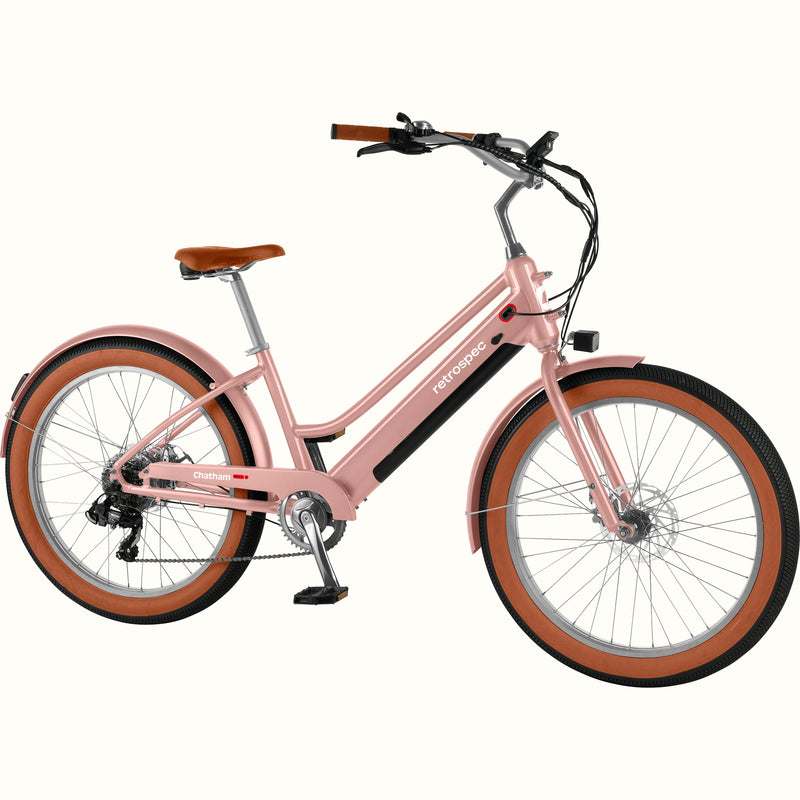 Pink Chatham Rev+ 2 Beach Cruiser Electric Bike - Step Through with brown wheels on a white background.