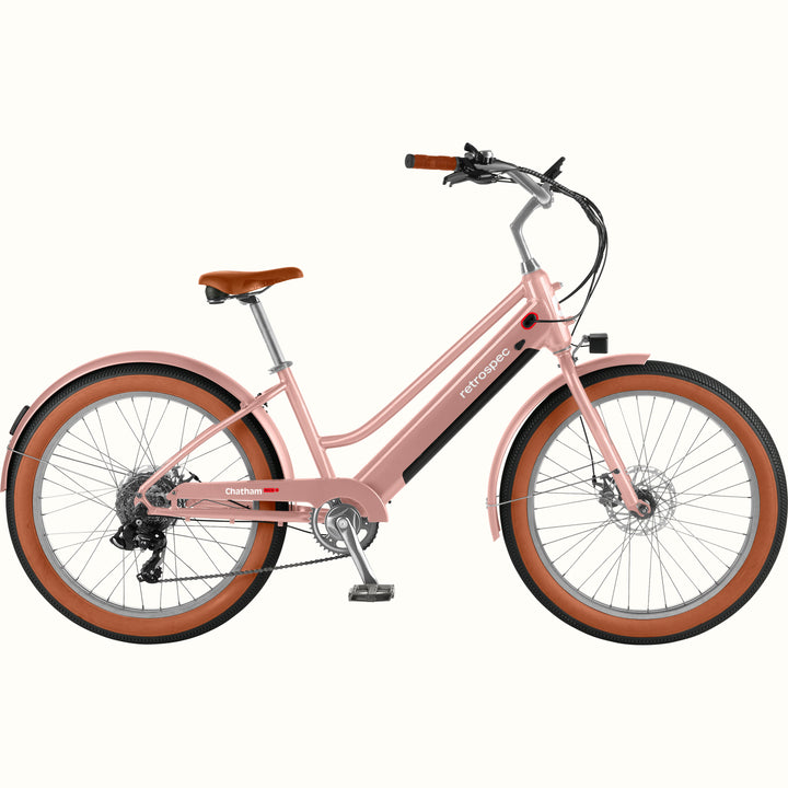 Pink Chatham Rev+ 2 Beach Cruiser Electric Bike - Step Through with brown wheels on a white background.
