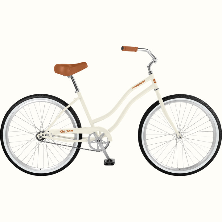 retrospec Chatham beach cruiser bike in eggshell white with brown saddle and cream frame