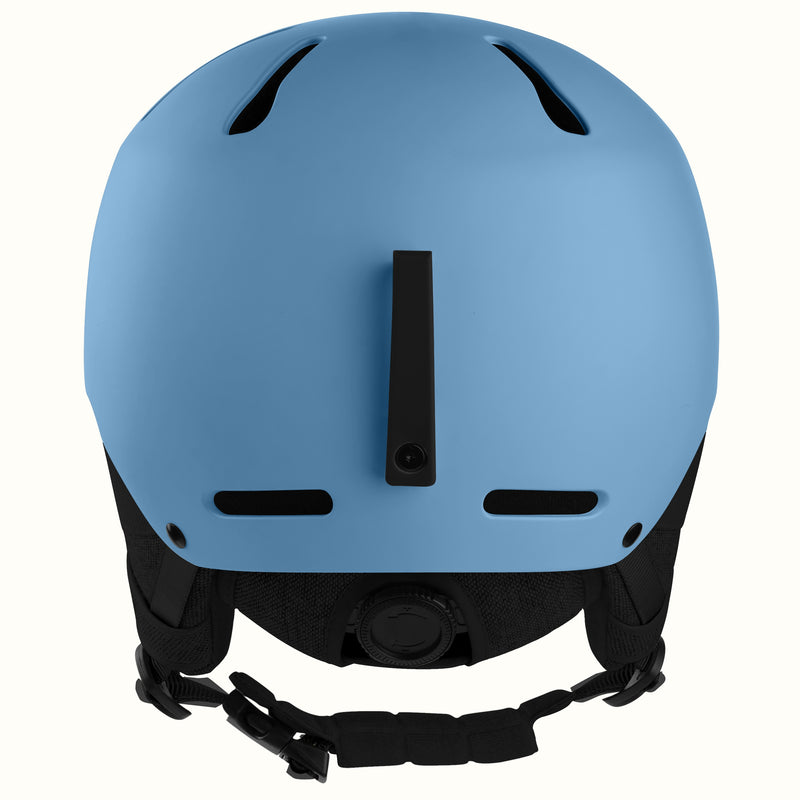 A matte blue ski helmet shown from the back, featuring black ventilation slots, a central vertical vent, and a black adjustable chin strap with plastic buckles, set against a plain white background.