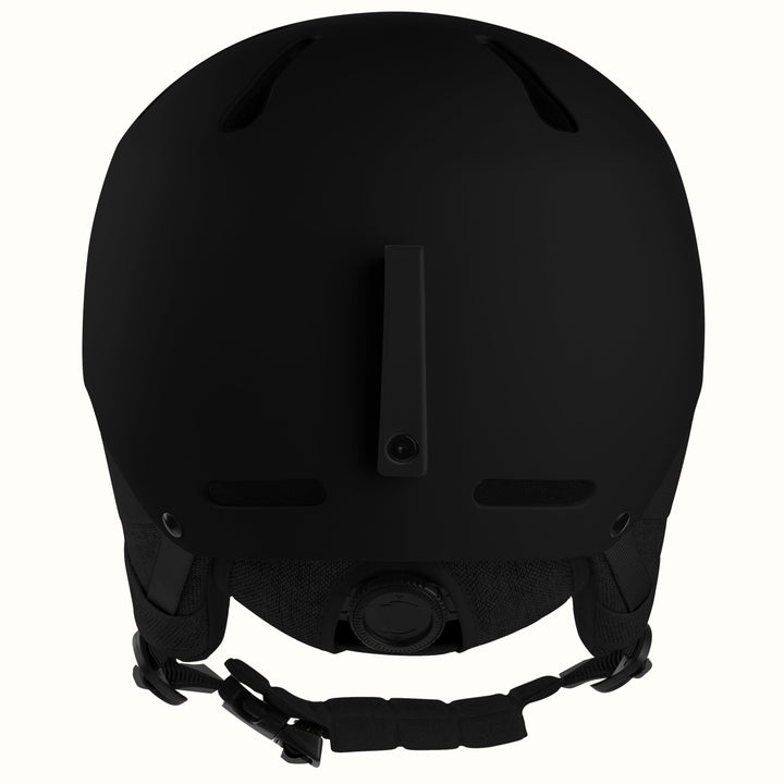 Matte black ski helmet shown from the back, featuring ventilation slots and an adjustable chin strap, isolated on a white background.