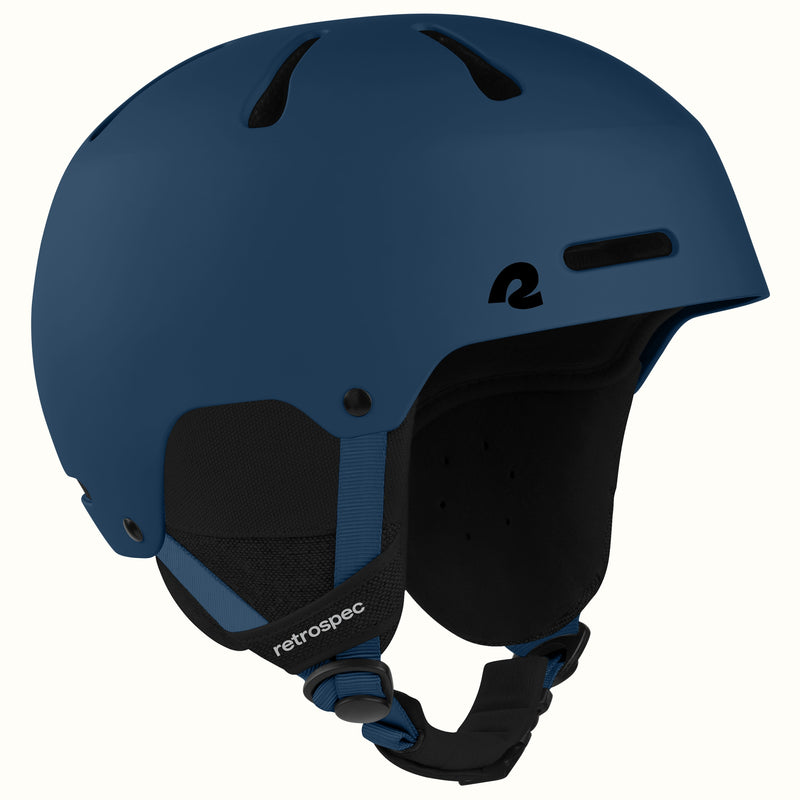 retrospec Comstock snowboard helmet in matte navy, angled view highlighting top vent channels.