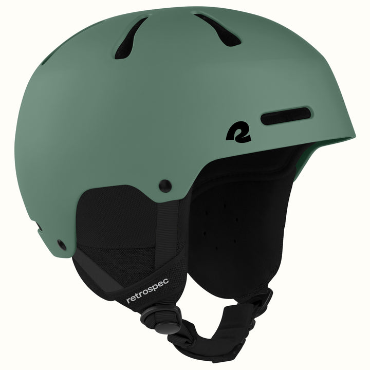 retrospec Comstock snowboard helmet in matte summit grove green, angled view highlighting top vent channels.