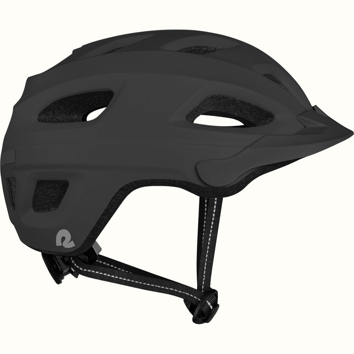 Side view of a Lennon Commuter Bike Helmet in Matte Black, showing the ventilation ports, reflective side strip, Retrospec logo, short visor, and adjustable chin strap against a clean background.
