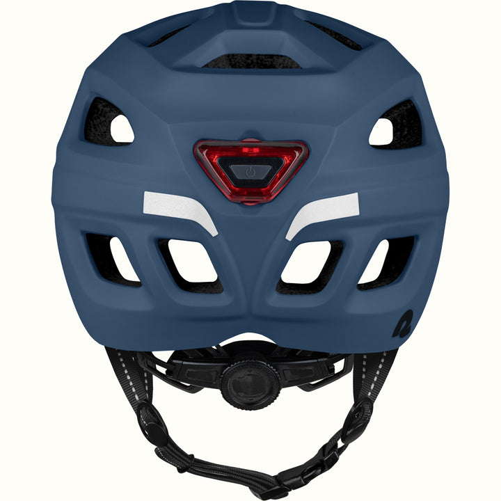 Rear view of a Lennon Commuter Bike Helmet in Matte Navy Blue, showing the integrated red LED safety light, reflective strips, ventilation ports, and adjustable dial fit system.
