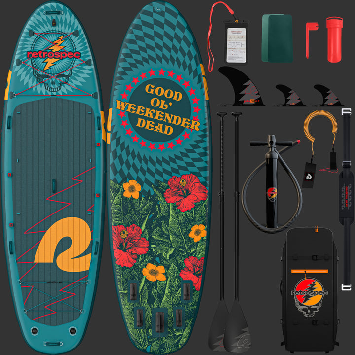 A front and rear view of the Grateful Dead Weekender Crew Multi-Person Inflatable Stand Up Paddle Board with "Good Ol' Weekender Dead," a "Steal Your Face" icon and flower designs, accompanied by two paddles and a black carrying bag with the "Steal Your Face" artwork and "retrospec" branding, along with the included accessories such as, cell phone case, patches, repair kit, fins, paddles, floor pump, leash, and carry strap.