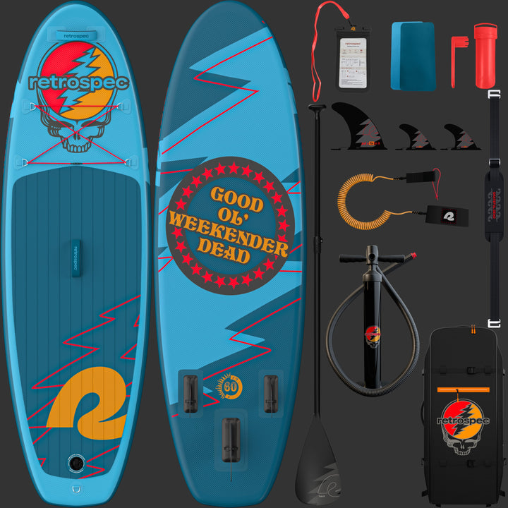 The vibrant Grateful Dead Weekender Nano Kids' Inflatable Paddle Board featuring the Grateful Dead Steal Your Face iconic artwork, a large "retrospec" bright orange logo, and red lightning bolt designs with red bungee cords and a textured surface for grip, alongside a paddle, carry strap, leash, repair kit and patches, fins, bag and cell phone case.