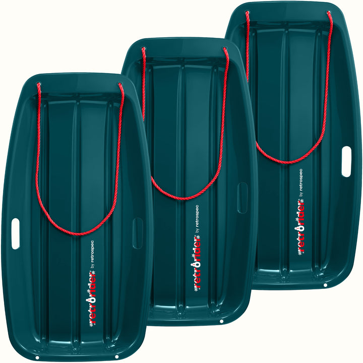 Three Retrorider Toboggan Snow Sled - 35” in Snowy Spruce with a red rope on a white background.