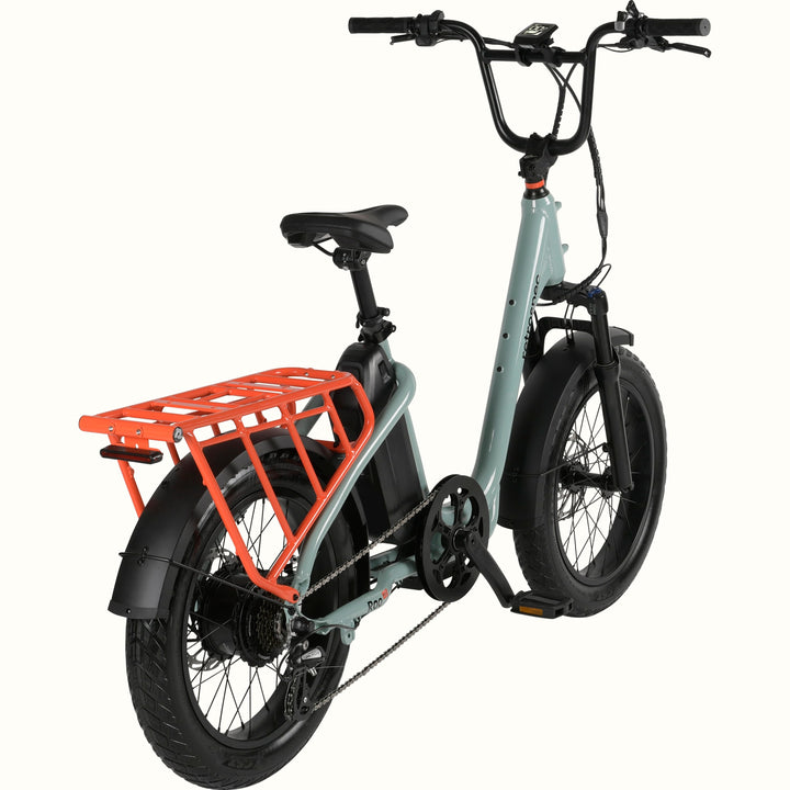 Mint green electric bike with an orange cargo rack on a white background.