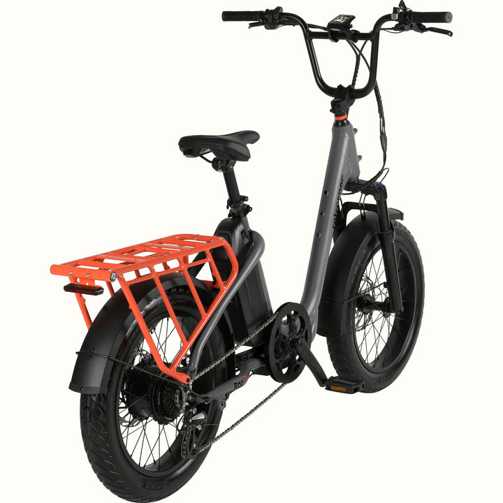 Gray electric bike with an orange cargo rack on a white background.