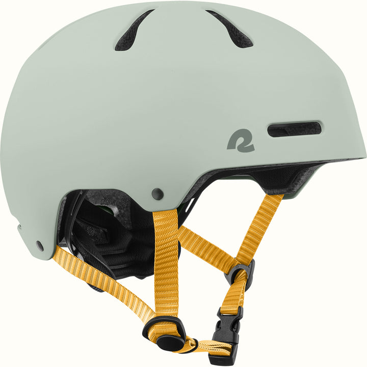 retrospec Dakota kids bike helmet in Matte Arbor sage green with top vents and a yellow adjustable chin strap.
