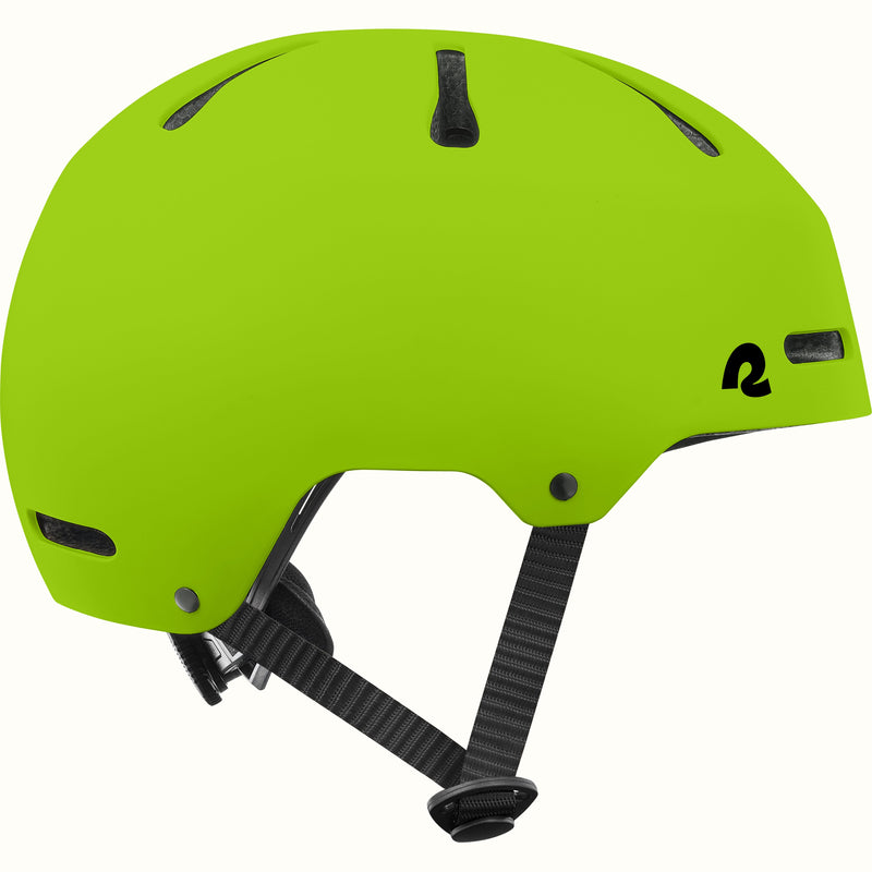 Side profile of the retrospec Dakota green bike helmet for kids with a matte finish, vents, and black side straps.