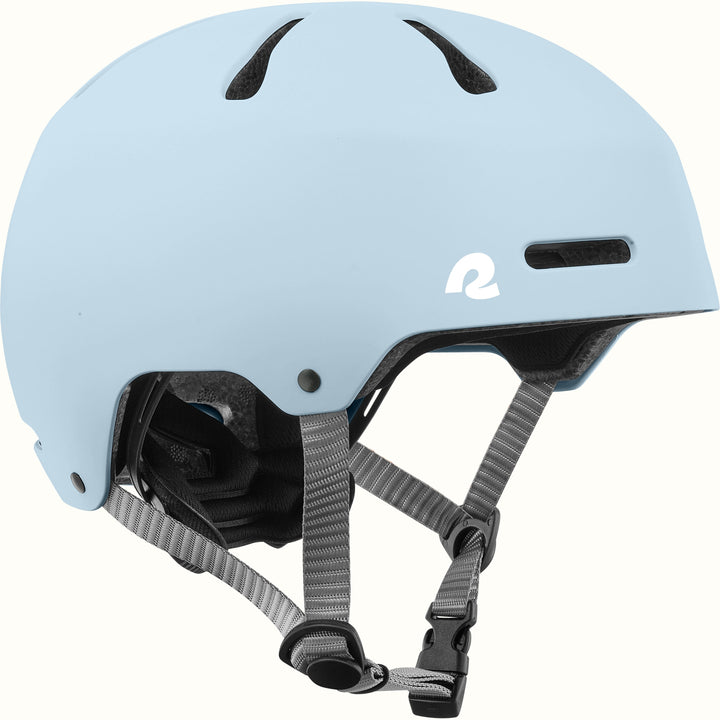 retrospec Dakota kids bike helmet in Matte Crystal Blue, side view with top vents, white logo, and gray straps.