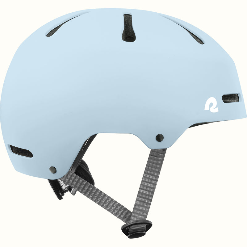 retrospec Dakota kids bike helmet in Matte Crystal Blue, side view with top vents, white logo, and gray straps.
