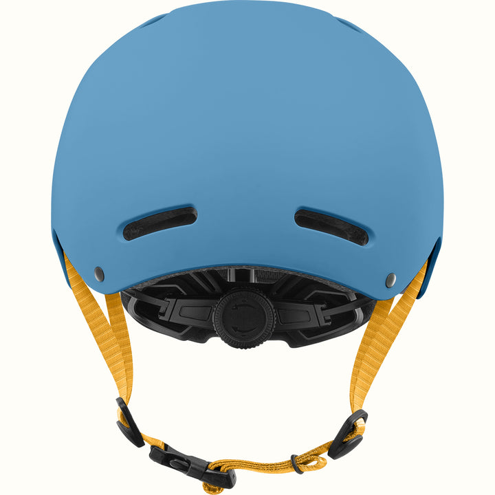Rear view of the retrospec Dakota kids helmet in matte blue with two back vents, yellow straps, and a black fit dial.